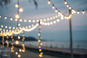 String Lights Bokeh Over Ocean Beach at Dusk with Soft Focus illuminated glowing isolated on a transparent background