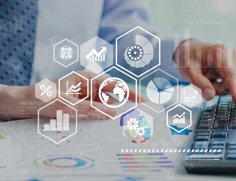 Business meeting with documents and graphs on desk