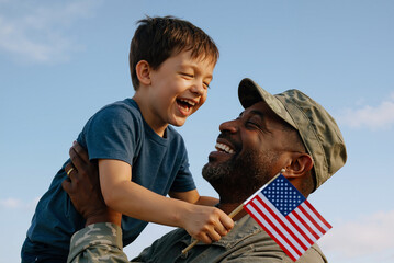 joyful soldier father holding son with american flag celebrating outdoors on sunny day