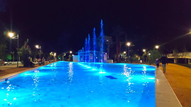 Fountain of Salina Municipal Park illuminated by night in Larnaca.