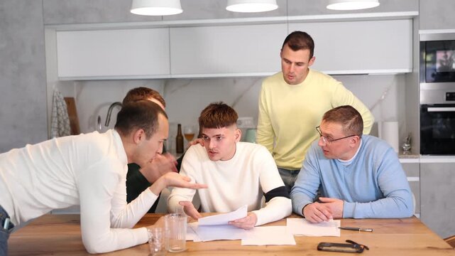 Man appearing upset as reading document, while friends gathering around, offering support and advices during friendly meeting at home kitchen