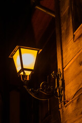 Old lantern in city street at night