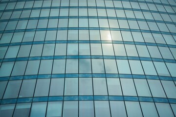 The texture of the windows of a tall skyscraper.