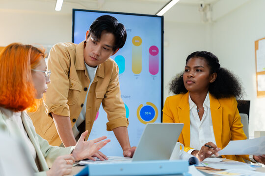 Group of young creative multiethnic business team brain storm meeting presentation,discussing roadmap to product launch, planning,strategy,new business development,working with new startup project - Powered by Adobe