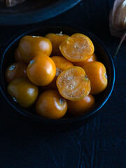 Fresh Golden Berries in Black Bowl on Dark Background