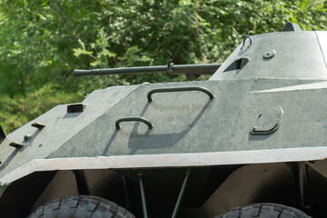 Fragment of BRDM-2 armored vehicle showing handles, hatches, and mounted machine gun in a close-up view.