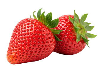 Two intensely red, fresh strawberries, one in sharp focus with intricate texture and emerald green calyx, the other blurred, on a transparent background, concept of fresh fruit and natural purity