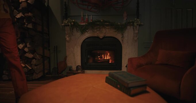 Relaxing with feet up in slippers by a crackling fireplace