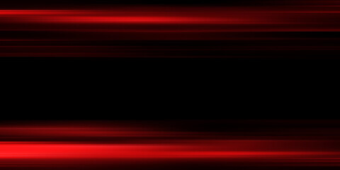 The effect of red light in fast motion on a black background. blurred abstract background with long exposure. neon light
