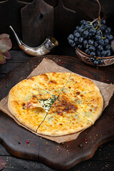 Spinach Khachapuri – Georgian Green Pie. Traditional Georgian Bread. Traditional Georgian cuisine styled with authentic atmosphere.