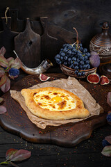 Adjarian Khachapuri with Egg and Cheese – Traditional Georgian Bread. Traditional Georgian Bread. Traditional Georgian cuisine styled with authentic atmosphere.