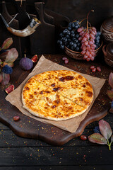 Potato and Cheese Khachapuri – Rustic Georgian Pie. Traditional Georgian Bread. Traditional Georgian cuisine styled with authentic atmosphere.