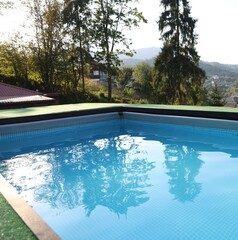 Outdoor swimming pool with clean water at resort