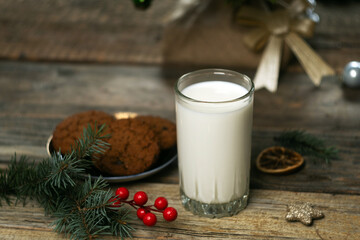 Christmas glass of milk and cookies for Santa Claus. Selective focus.