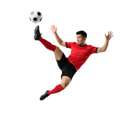 Dynamic asian soccer player mid air executing a powerful kick towards the ball perfectly isolated
