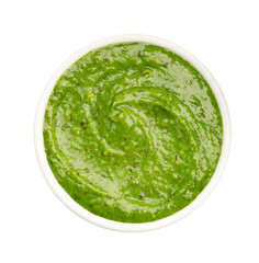 Fresh pesto sauce in bowl isolated on white, top view