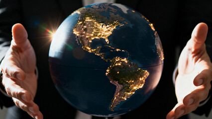 GlobeInHandsWithCityLights