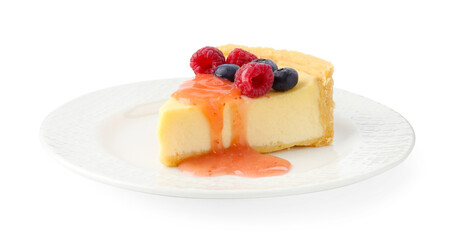 Piece of delicious cheesecake with fresh berries and sauce isolated on white