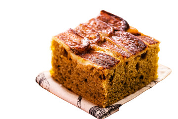 egan banana bread or cake made with organic banana, on isolated white background, copyspace. Traditional homemade cake from Brazil, sold in bakeries