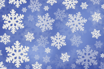 Christmas blue background of white snowflakes flying in the air. Holiday card for New Year and Christmas with space for greetings, labels and your design.