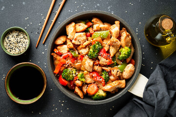 Chicken stir fry with vegetables and sesame.