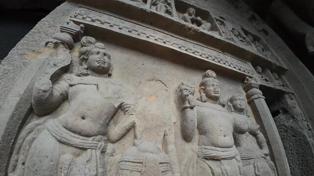 The Rich Texture and Fine Craftsmanship of Ancient Rock-Cut Reliefs Adorning a Wall in the Kanheri Cave Complex, Evoking Spiritual Heritage.