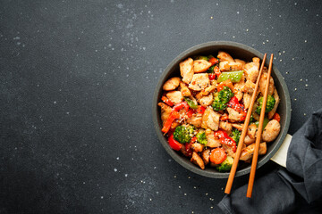 Chicken stir fry with vegetables and sesame.