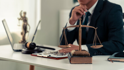Lawyer, businessman working with law books and gavel in office or courtroom for justice. Courtroom.
