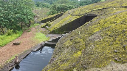 Engineering of the Ancients: Detailed View of a Carved Water Reservoir Used for Monastic Drinking Supply at the Historic Kanheri Caves Complex, Mumbai, India 