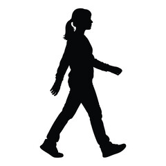 Silhouette of a young girl in motion walking confidently outdoors captured in high contrast silhouette