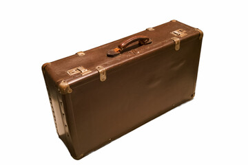 Old leather suitcase resting on a white surface with a wooden handle, ready for travel adventures and new journeys