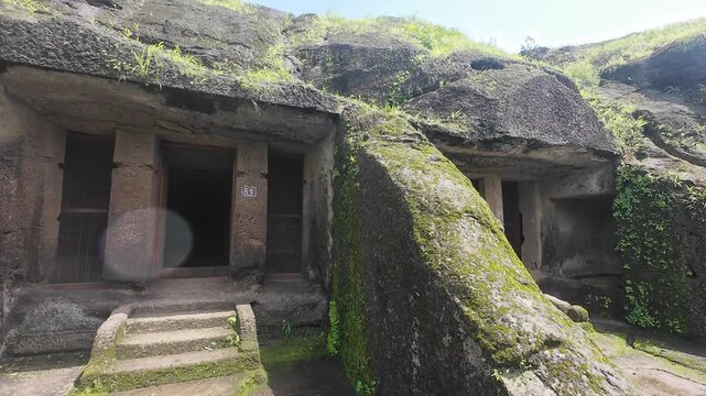  A Buddhist cave from the Kanheri Caves complex in Mumbai, highlighting detailed carvings and serene atmosphere
