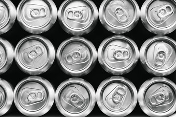 Stainless steel beer cans in factory setting for beverage production