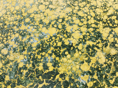 Aerial view of a mesmerizing mosaic of golden droplets scattered across a sea of emerald and deep blues, Bay of C&Atilde;&iexcl;diz, C&Atilde;&iexcl;diz province, Andalusia, Spain.