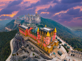 Aerial view of ba na hills fantasy architecture castles and French village at sunset in Da nang, Vietnam