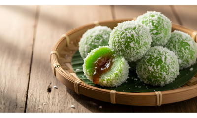 Close-up Photography of Traditional Indonesian Snack Klepon.
Close-up photography of traditional Indonesian klepon, green glutinous rice balls filled with liquid brown sugar, sprinkled with grated whi