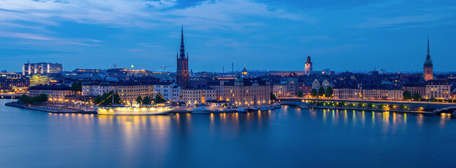 Beautiful panoramic City Skyline of Stockholm at Dusk with Illuminated Waterfront
