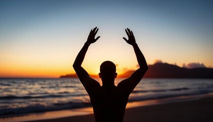 Sunset silhouette of a figure with arms raised on a beach,  sunset,  relaxation