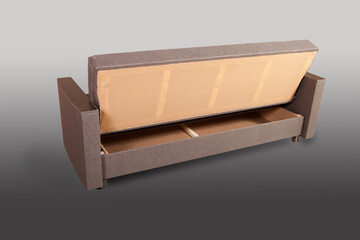 Isolated sofa bed with fabric upholstery on grey gradient background.