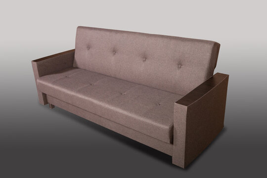 Isolated sofa bed with fabric upholstery on grey gradient background.