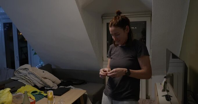 Mother holding a Christmas ornament. Night