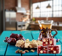 Traditional plate with sweet date fruits and tea