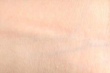 Human skin, closeup view. Detailed texture of surface