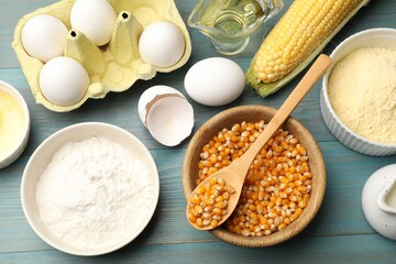 Cornbread preparation. Different ingredients on light blue wooden table, flat lay