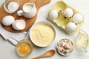 Making cornbread. Different ingredients on white marble table, flat lay