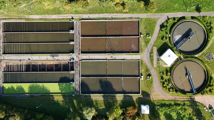 Aerial View of a Modern Wastewater Treatment Plant with Circular and Rectangular Clarifier Tanks