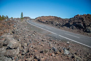 Tenerife - Winding Road Through Desolate Volcanic Landscape Under a Clear Azure Sky
