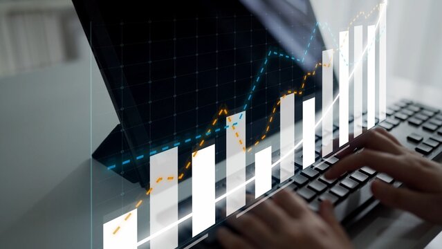 A businesswoman analyzes financial data on her laptop, surrounded by graphs and statistics highlighting market trends and growth potential in a modern workspace. Copula
