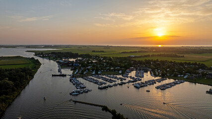 Aerial sunset from the harbor at Galamadammen near Koudum in Friesland the Netherlands