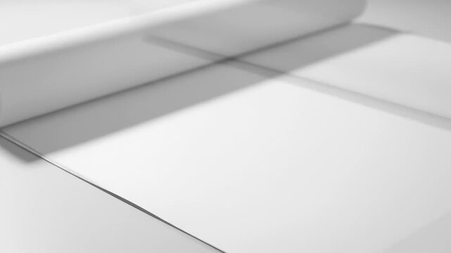 White paper roll gradually unrolling on a smooth surface, showcasing the texture and flow of the paper in a seamless motion sequence